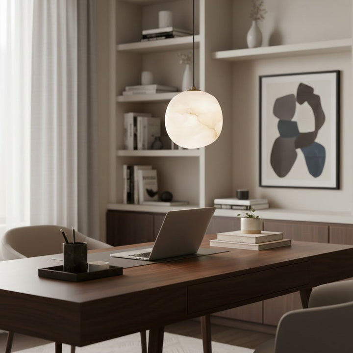 Designer brass pebble pendant light, minimalist aesthetic, perfect for modern lighting.