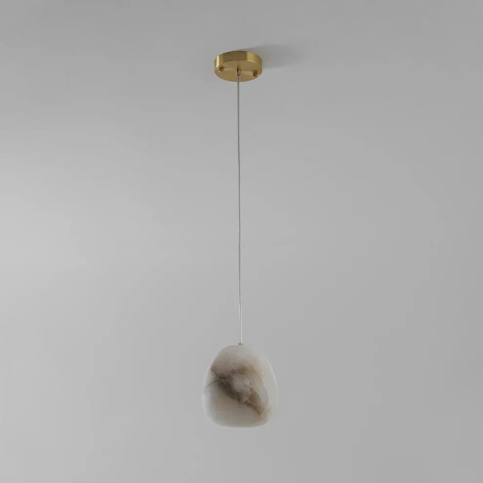 Contemporary brass pebble pendant, elegant and modern, for sophisticated interior lighting.