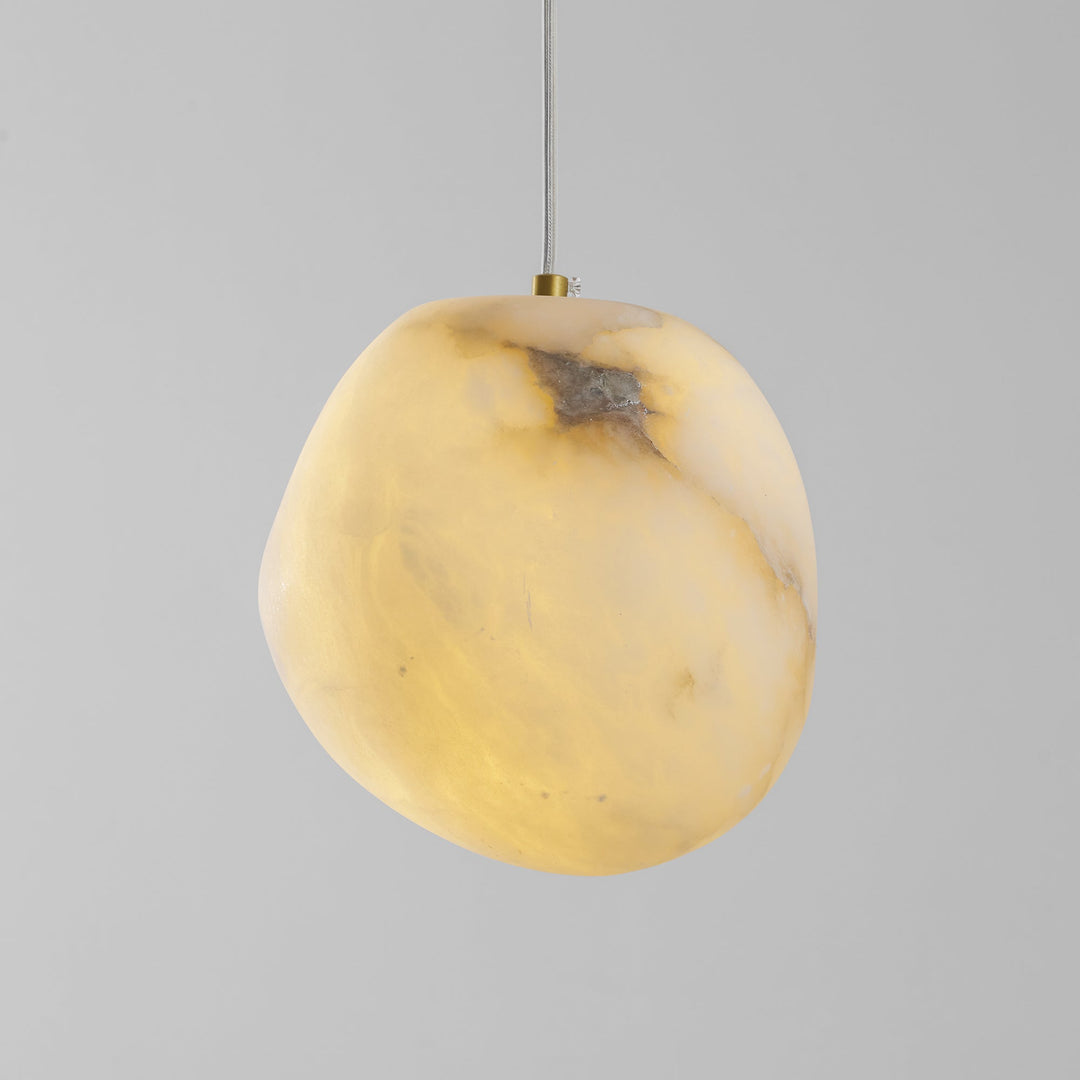 Stylish brass pebble pendant lamp, modern decor, perfect for accentuating home spaces.
