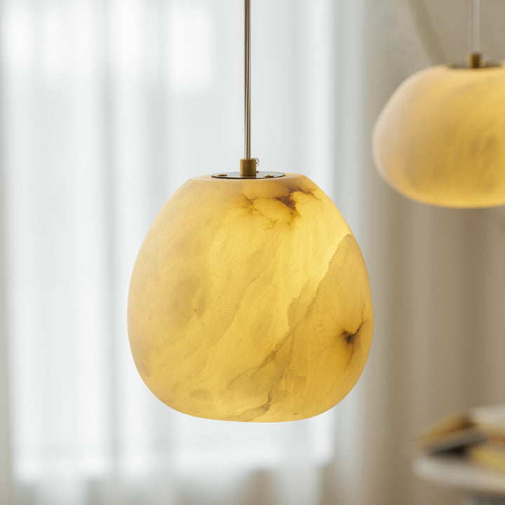 Elegant brass pebble ceiling light, modern design, a focal point in any room's decor.