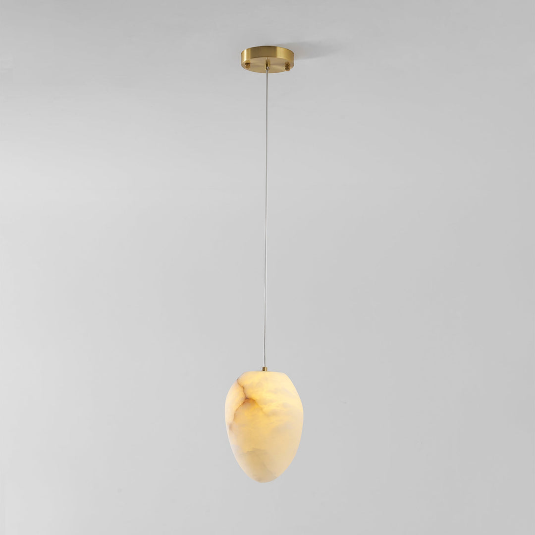 Elegant brass pebble pendant light, organic form, ideal for minimalist ambient lighting.