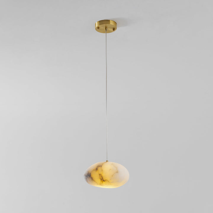 Contemporary brass pendant light, pebble shape, ideal for elegant modern interior decor.