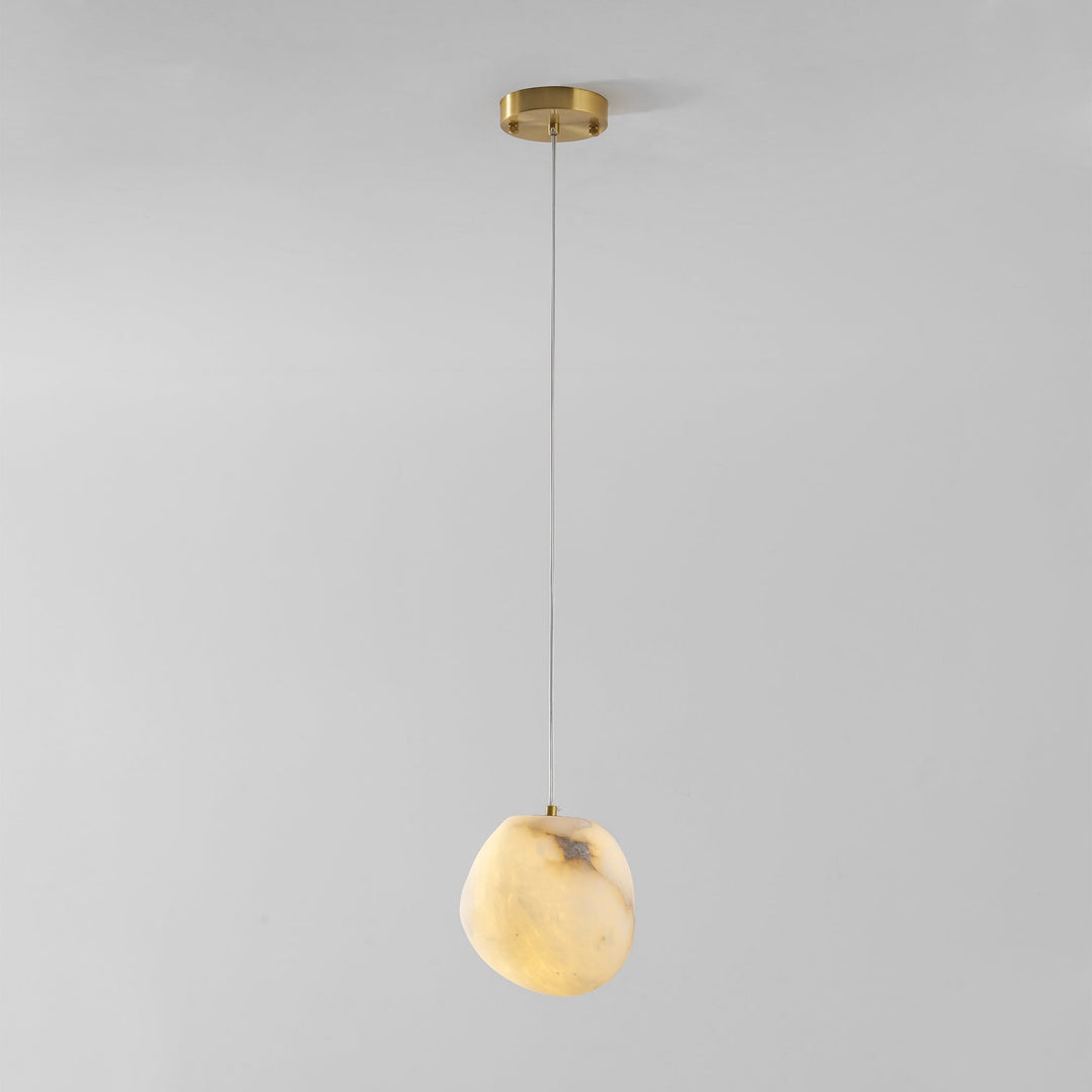 Brass pebble pendant light, elegant minimalist design, perfect for contemporary decor.