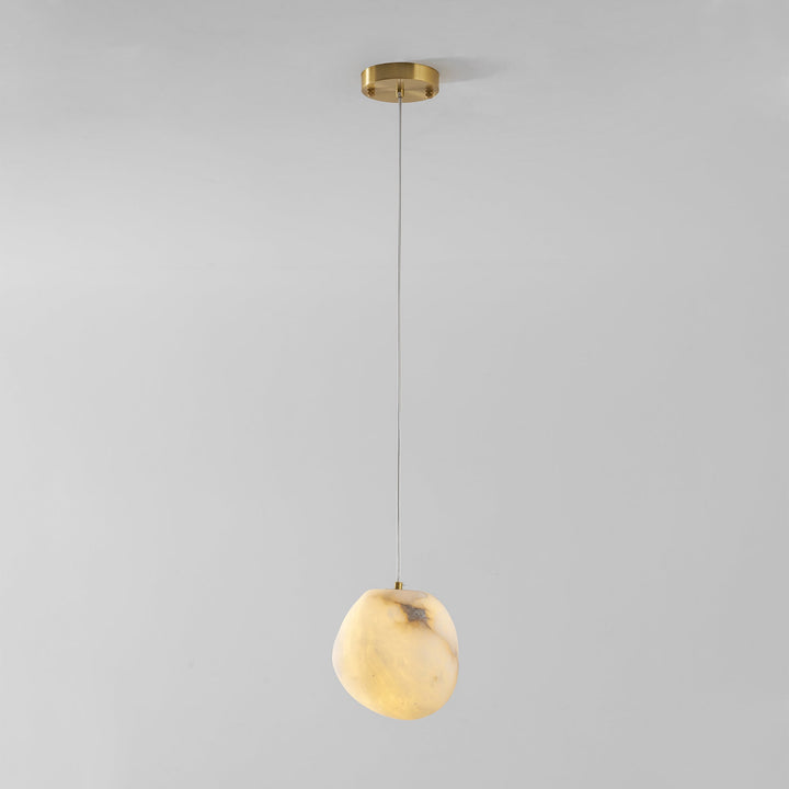 Brass pebble pendant light, elegant minimalist design, perfect for contemporary decor.