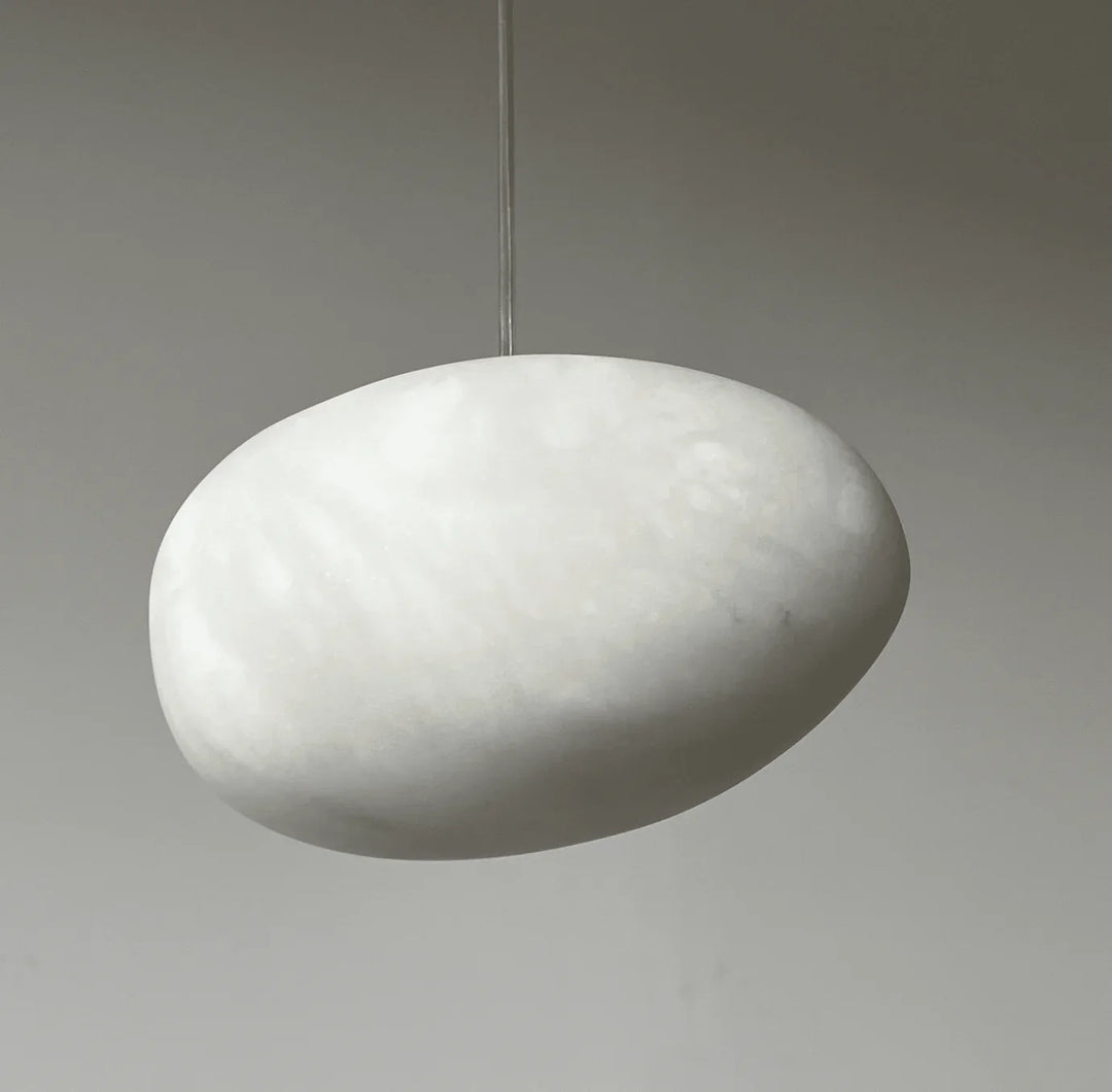 Polished brass pebble pendant light, contemporary, minimalist, perfect for modern home decor.