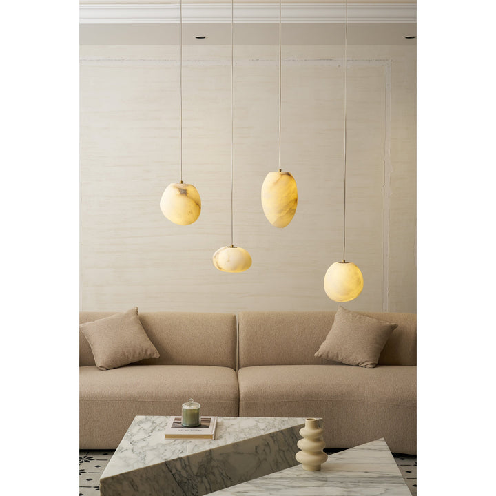 Modern brass pebble pendant, unique organic design, a key piece for contemporary decor.