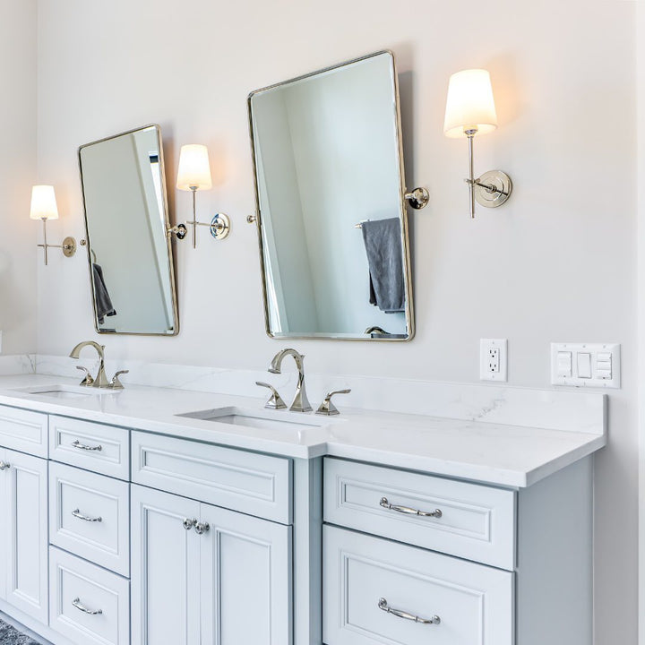 Chic Brass indoor sconce with linen shade, perfect for elegant dining.