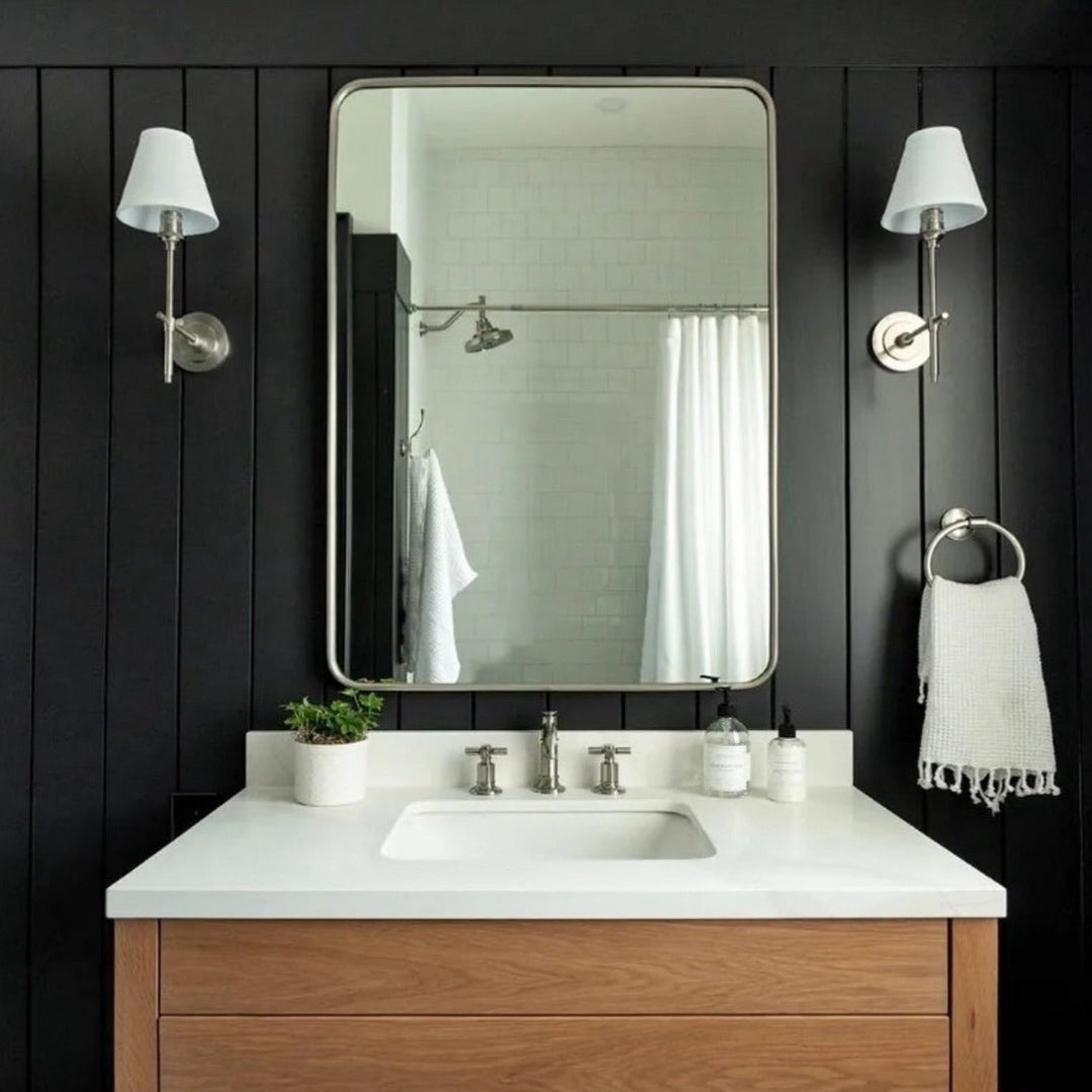 Elegant Black wall sconce with fabric shade for bedroom ambient lighting.