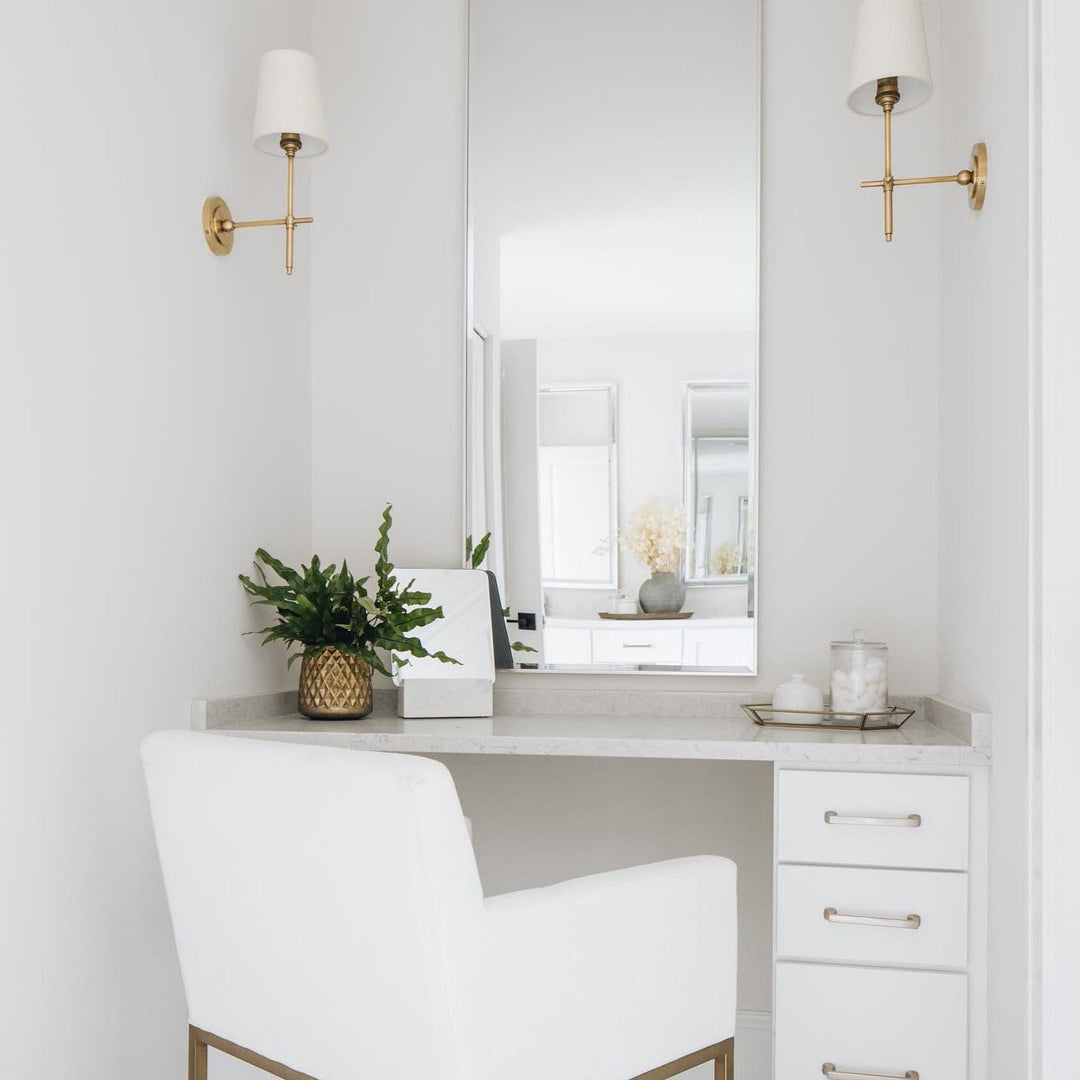 Stylish Black wall light fixture with drum shade for elegant hallway illumination.