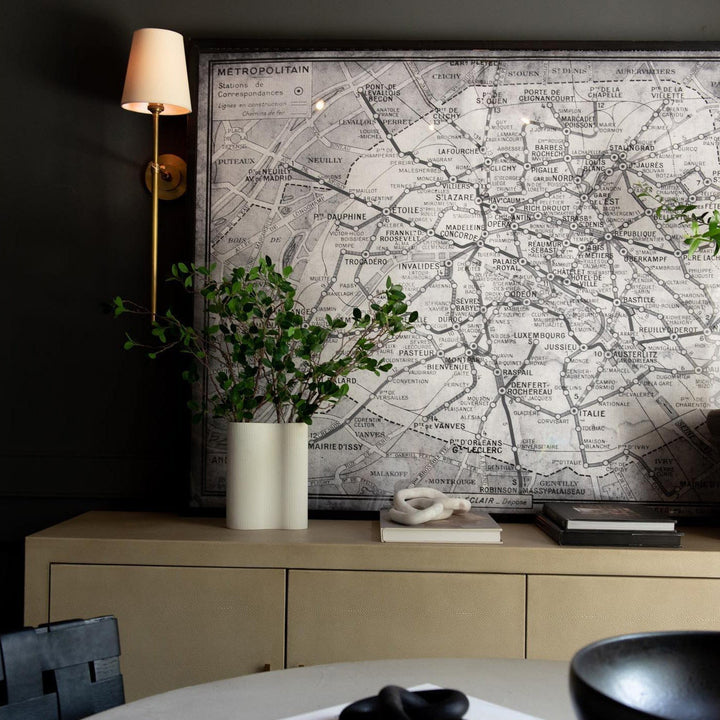 Contemporary Black wall lamp with soft fabric shade for cozy bedroom lighting.