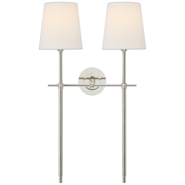 Modern Black wall sconce with fabric shade for ambient dining room light.