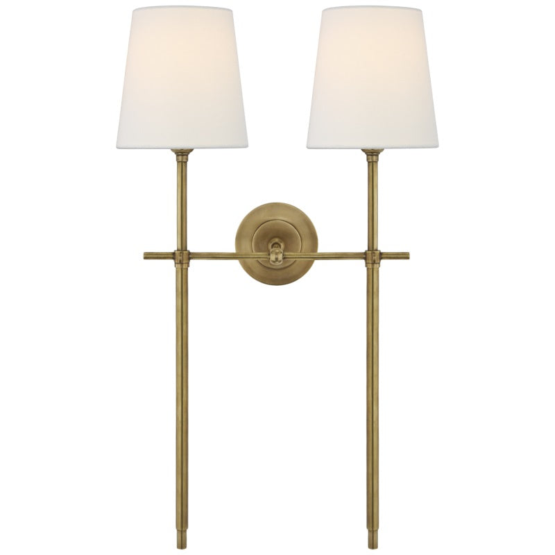 Contemporary Nickel wall lamp with soft fabric shade for cozy bedroom lighting.