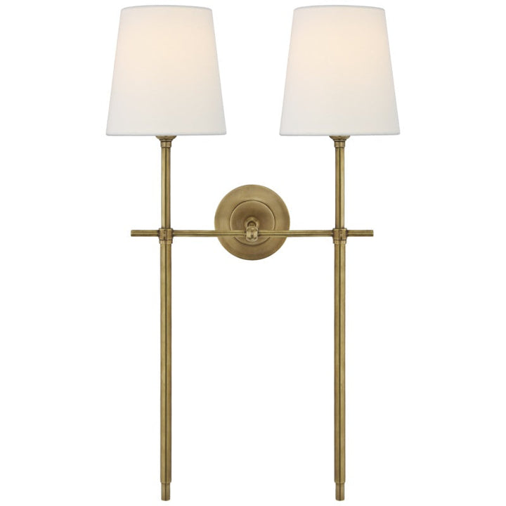 Modern Nickel wall sconce with fabric shade for ambient dining room light.