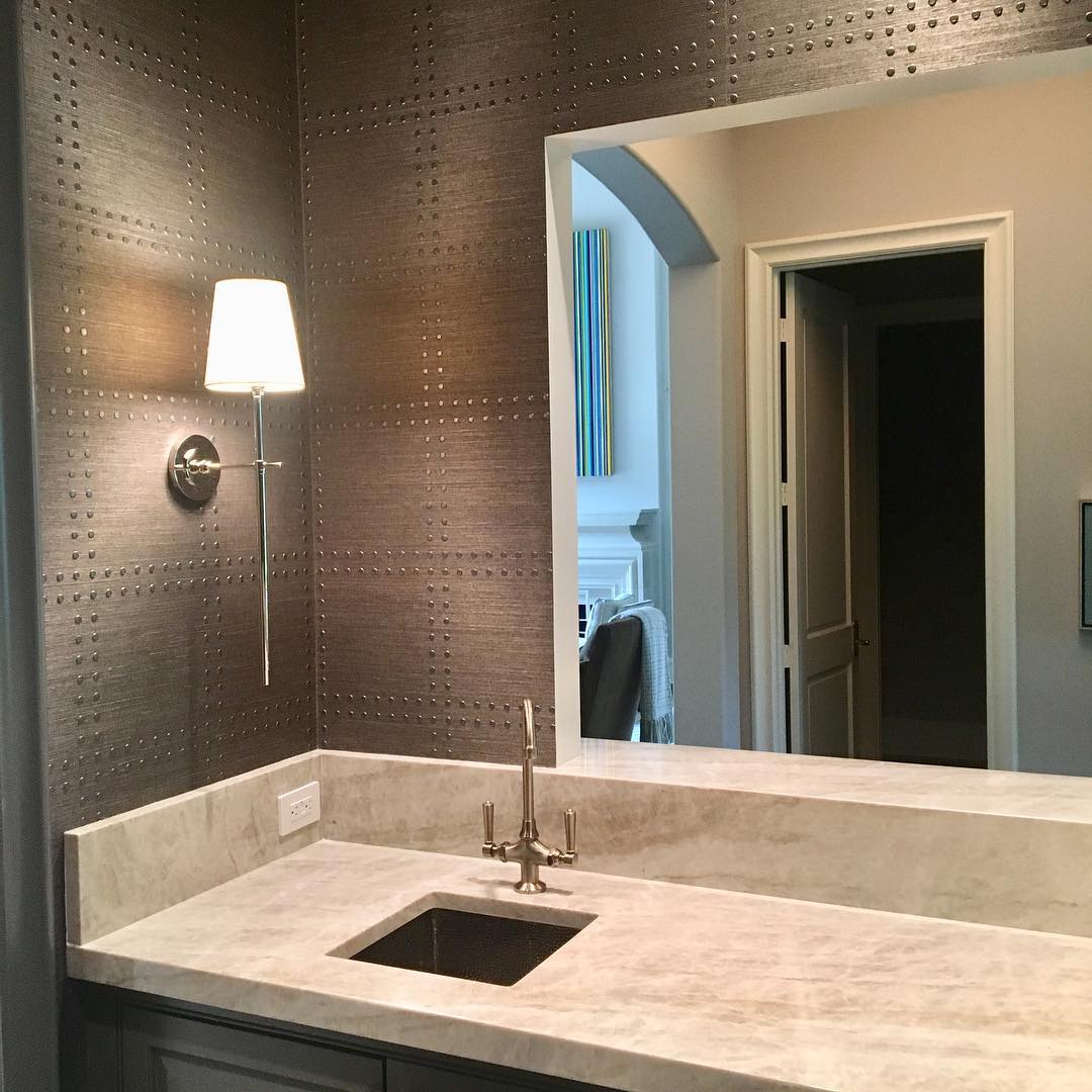 Decorative Brass wall light with linen shade, ideal for modern living rooms.