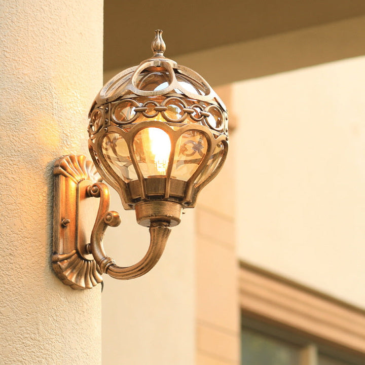 Elegant outdoor wall lamp in bronze finish, perfect for exterior home lighting. Weather-resistant design.