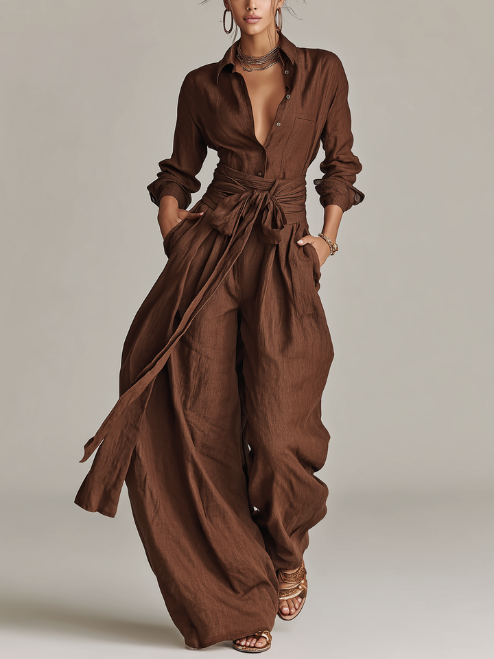 Elegant brown women's floor length overlay jumpsuit with chic cuffed sleeves. Perfect for smart casual or formal wear.