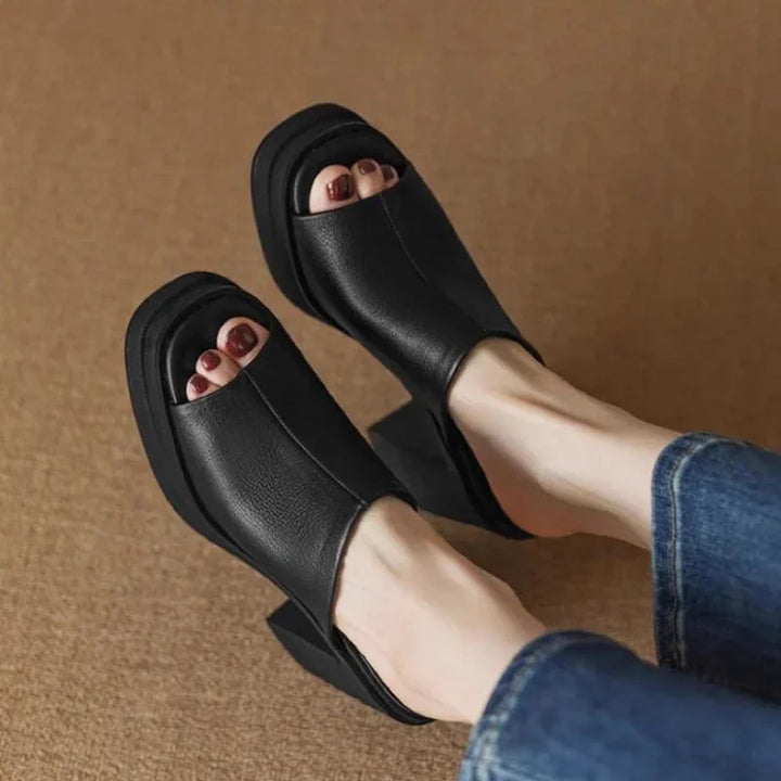 Brown women's elegant peep-toe mule sandals. Comfortable platform with block heel for chic summer style.
