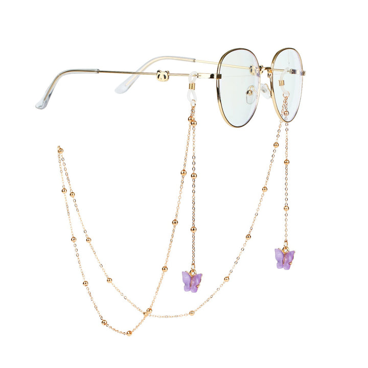 Elegant butterfly eyewear holder chain for women, a sophisticated fashion accessory.