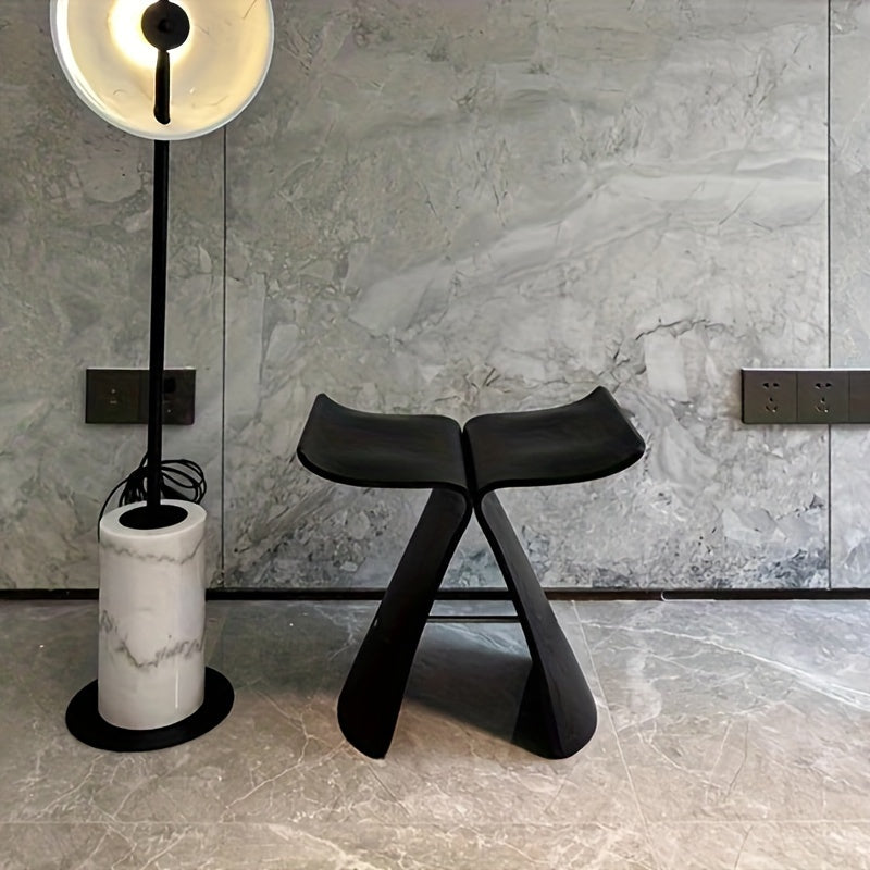 Sleek curves & natural wood finish of this elegant solid wood butterfly stool. Modern design.