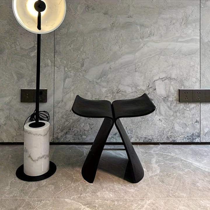 Sleek curves & natural wood finish of this elegant solid wood butterfly stool. Modern design.