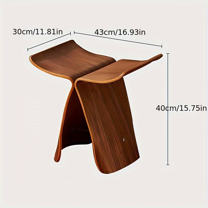 Elegant solid wood butterfly stool with sleek, modern design. A sophisticated accent piece.