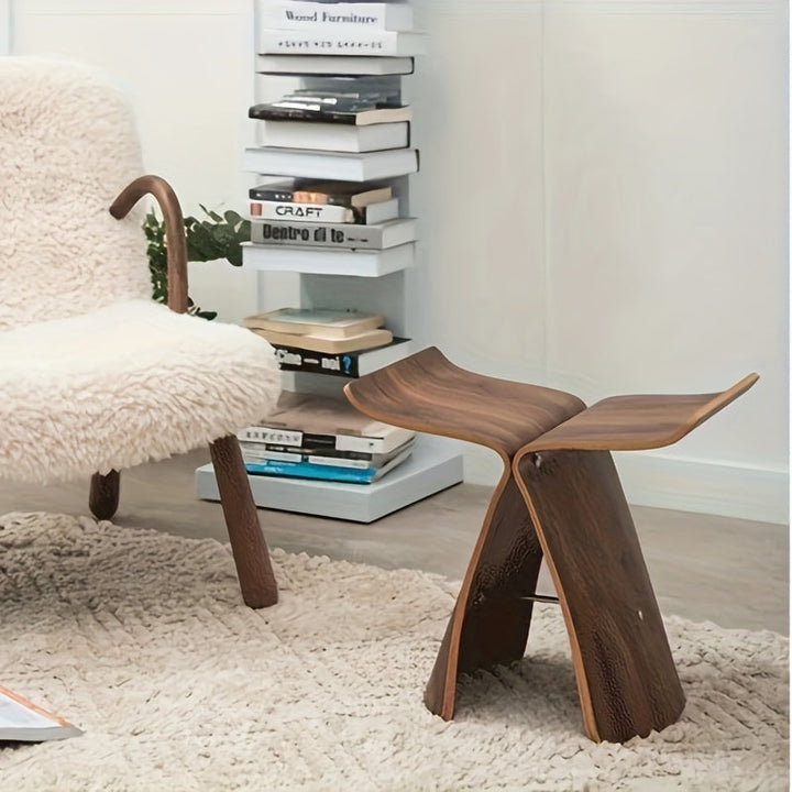 Iconic butterfly wood stool. Natural solid wood grain & modern design. Elegant & versatile.