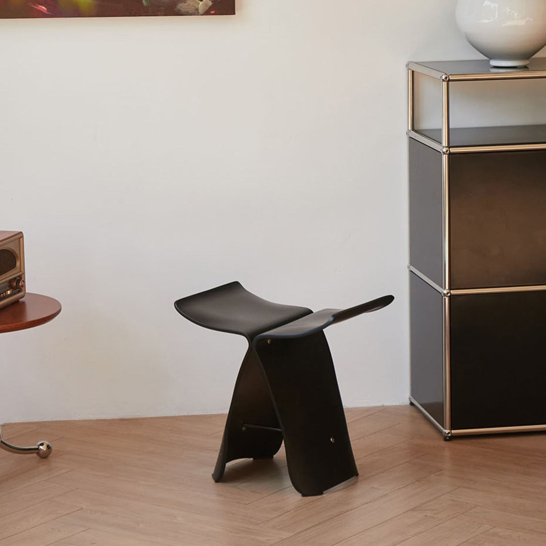 Handcrafted solid wood butterfly stool. Modern, elegant addition to your living room decor.