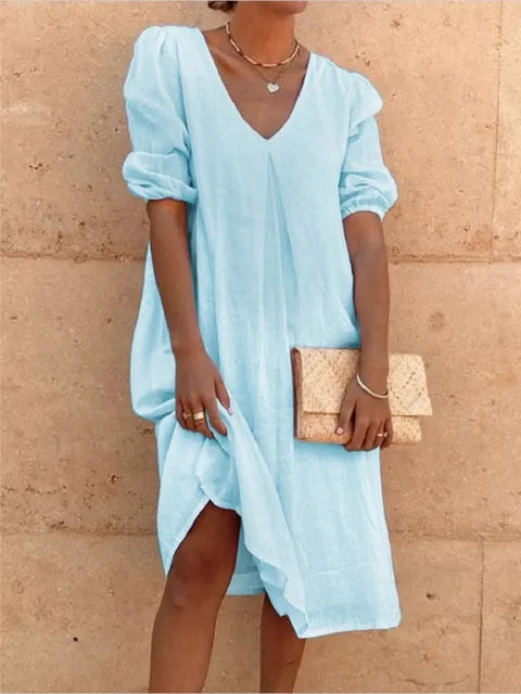 Chic V-neck midi dress with stylish bubble sleeves. A comfortable, versatile summer dress for casual or elegant occasions.