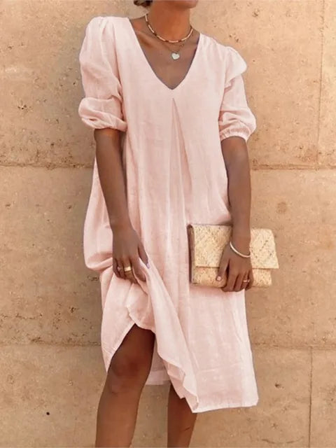 Versatile elegant casual midi dress for women. A comfortable summer fashion piece with a v-neck & bubble sleeves, perfect for any occasion.