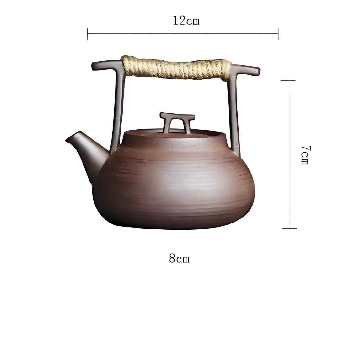 A complete ceramic tea set: elegant teapot paired with a functional tea warmer for serene moments.