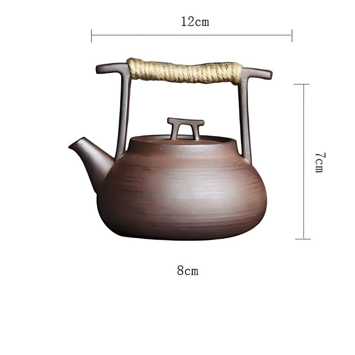 A complete ceramic tea set: elegant teapot paired with a functional tea warmer for serene moments.