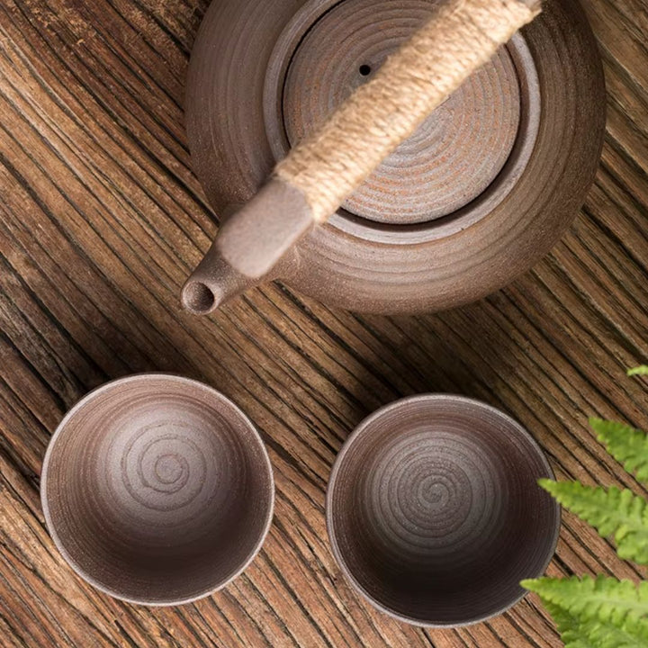 Handcrafted ceramic teapot and integrated tea warmer, ensuring your hot tea stays warm for longer.