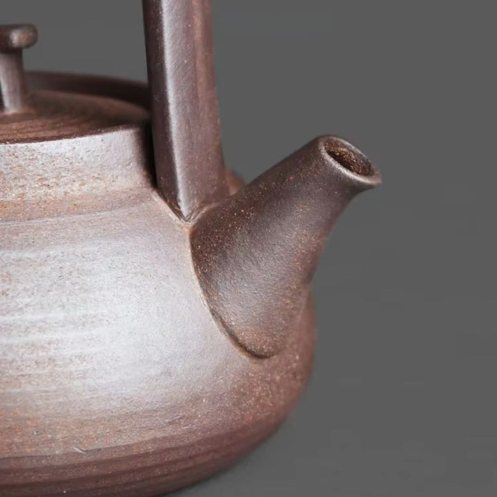 Full ceramic tea set featuring a teapot and a sleek tea warmer, designed for ultimate relaxation.