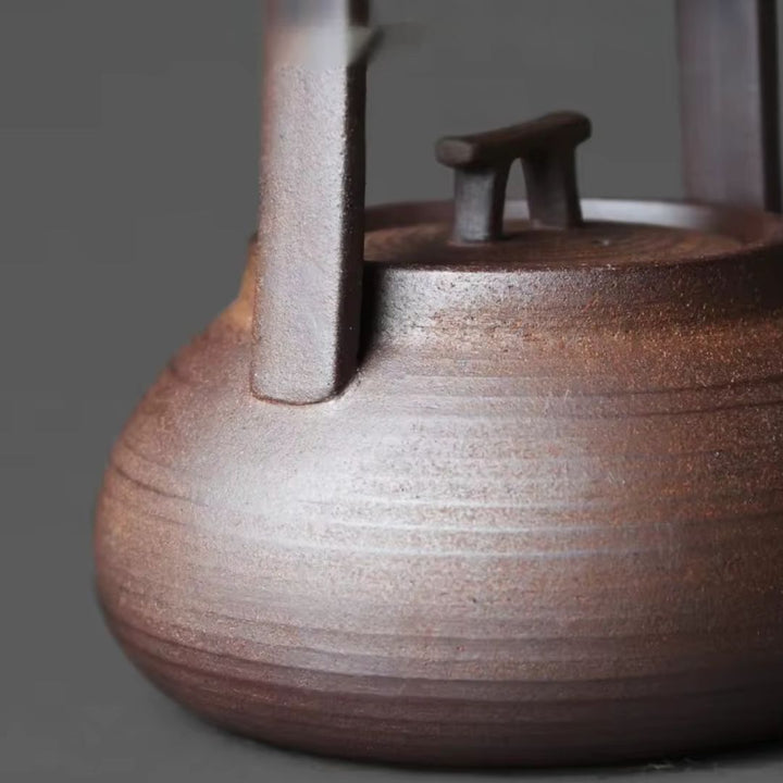 Modern ceramic teapot with a functional tea warmer, enhancing your daily hot tea experience.