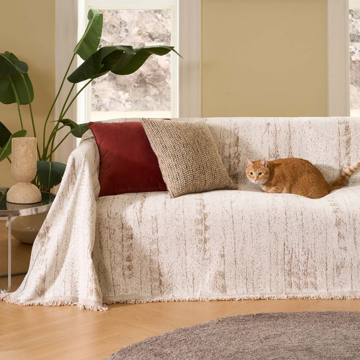 Textured elegant chenille sofa cover in a modern living room setting. Cozy home accent & protection.