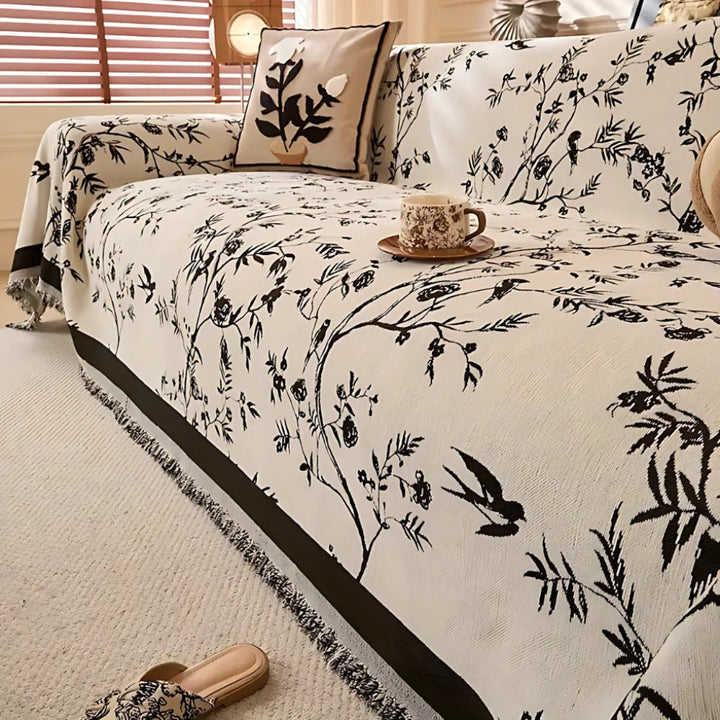 Beautiful floral patterned throw blanket with soft chenille and elegant fringe for a cozy living space.
