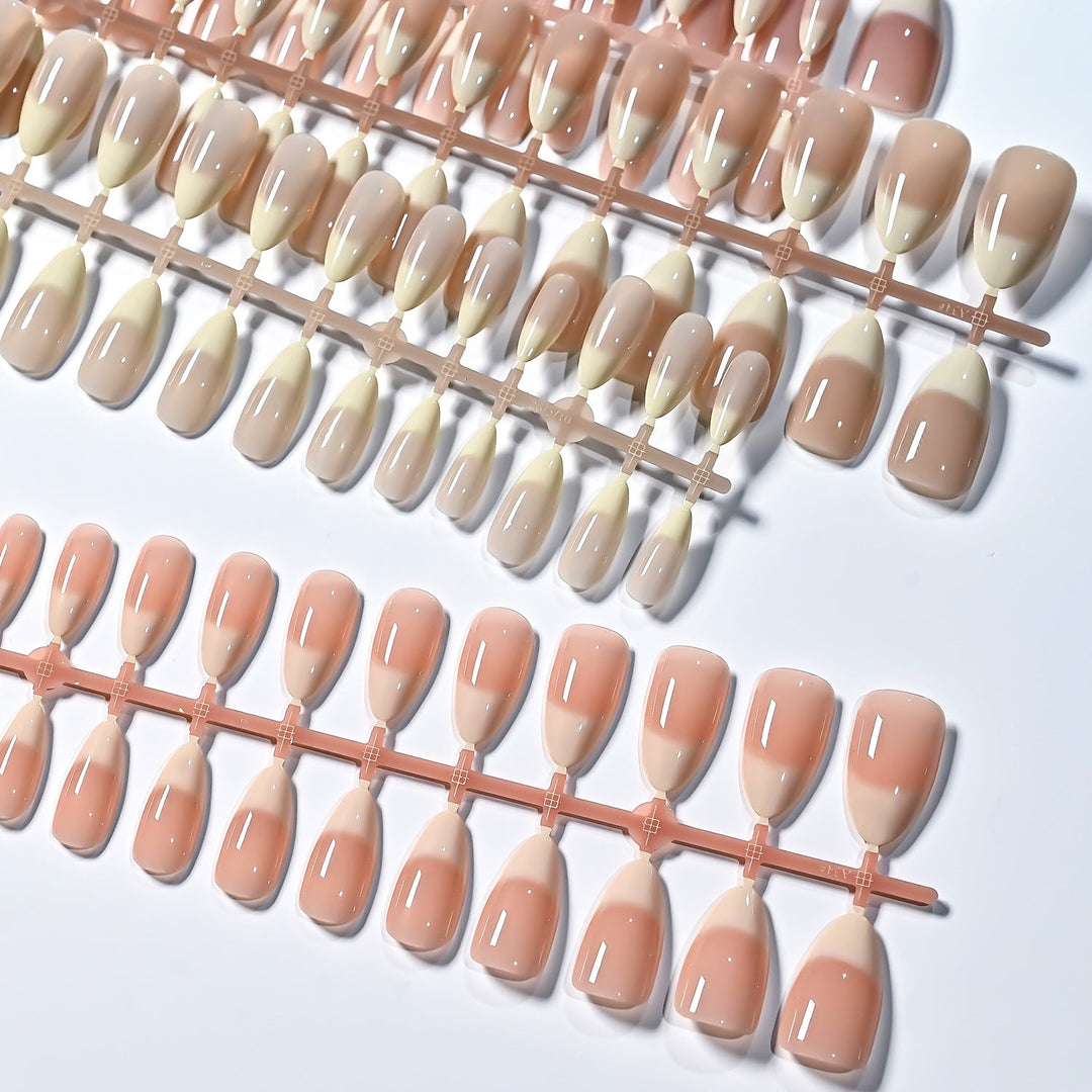 Reusable French tip false nails for women. Elegant press-on set for a quick and convenient nail art look.