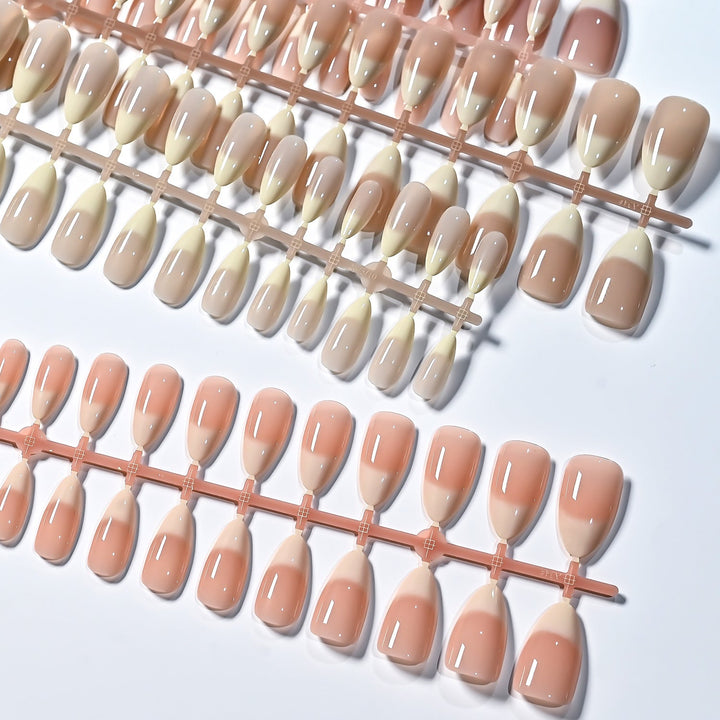 Reusable French tip false nails for women. Elegant press-on set for a quick and convenient nail art look.