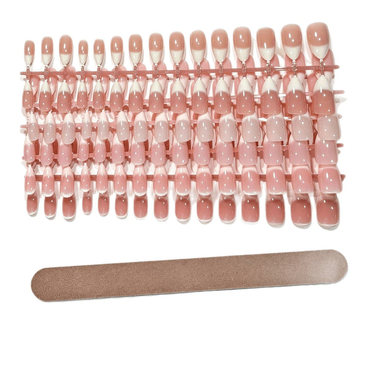 DIY manicure with removable French tip press-on nails. Achieve elegant false nails instantly.