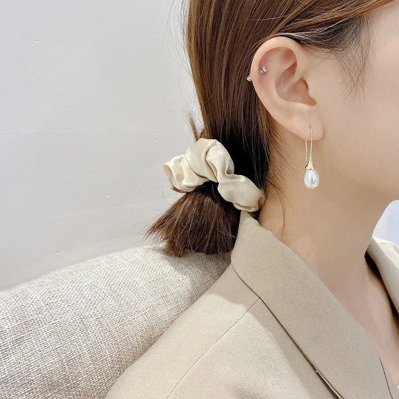 Timeless pearl drop earrings for women, an elegant classic jewelry piece. Beautiful accessory, a thoughtful gift for her.