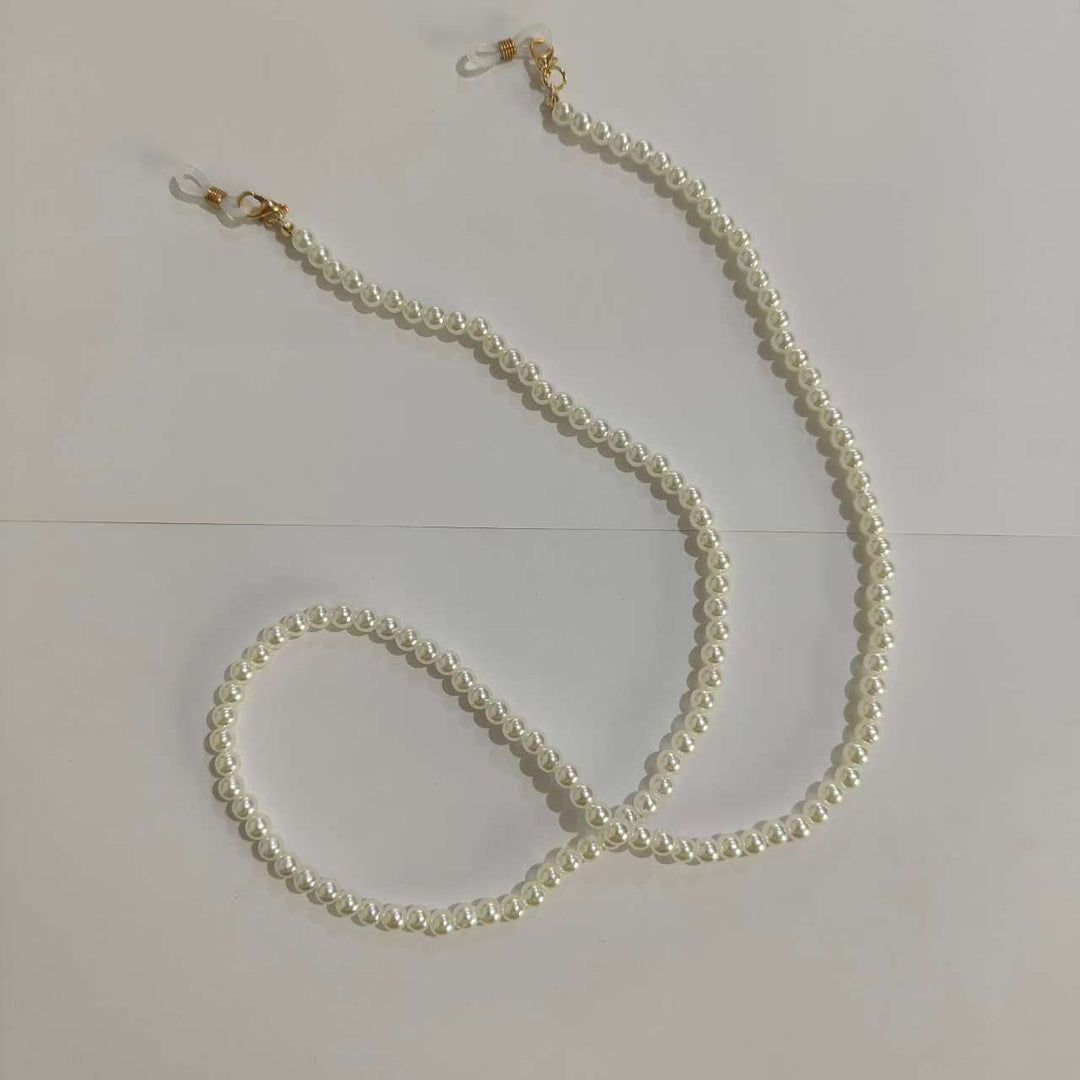 Elegant cream pearl glasses chain, 28-inch, for women. Stylish eyewear accessory & neck holder.