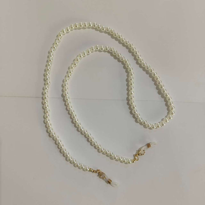 Stylish 28-inch cream pearl glasses chain for women. Elegant eyewear accessory & practical neck holder.