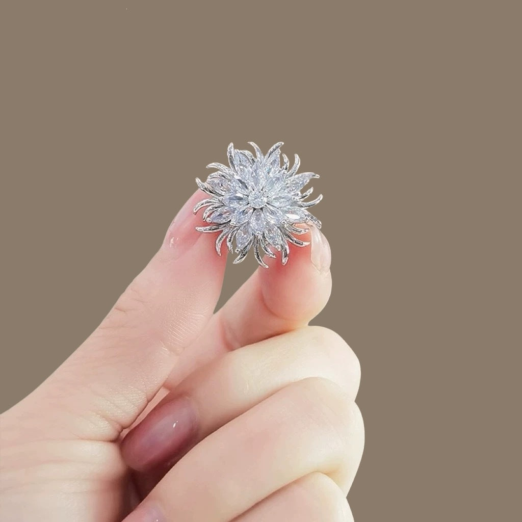 Versatile elegant crystal brooch for women, sparkling sunburst pin, enhances any outfit.