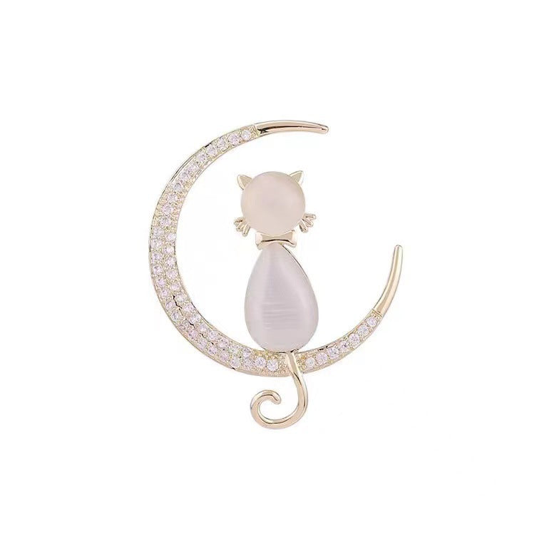 Intricate cubic zirconia cat brooch, a high-quality elegant pin. Sparkling women's jewelry, unique feline design.