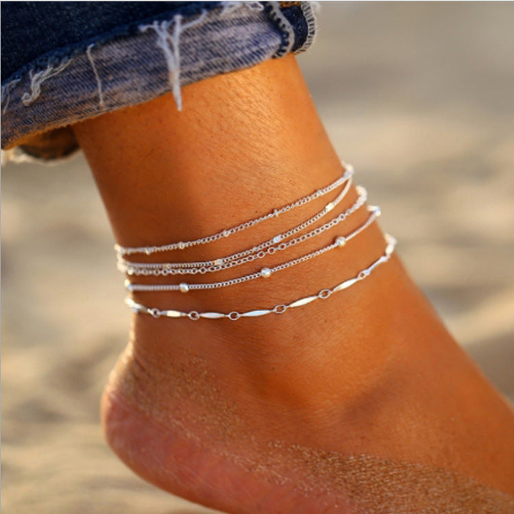 Elegant dainty chain anklet for women, perfect foot jewelry. Adjustable & stylish gold or white tone.