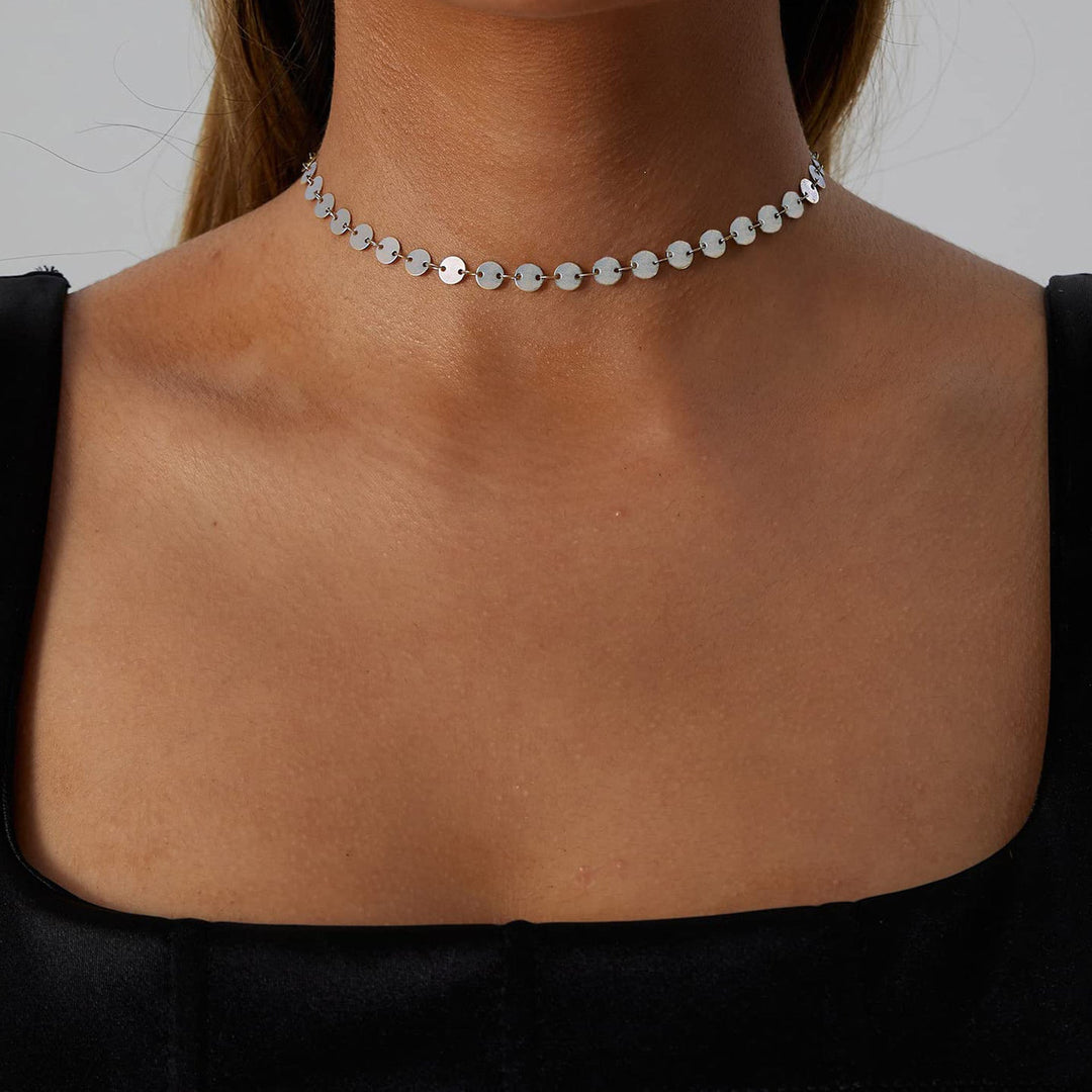 Assortment of dainty choker necklaces: gold & silver-toned options with pearl, crystal, and heart designs.
