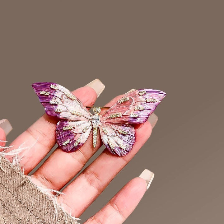 Elegant dark lilac butterfly brooch pin, a beautiful women's accessory.