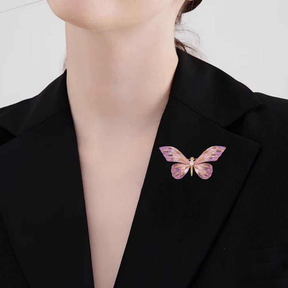 Fashionable dark lilac butterfly pin, an elegant accessory for women's outfits.