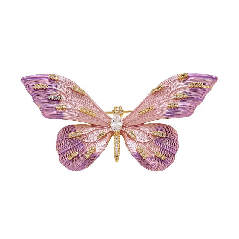 Exquisite butterfly brooch pin with dark lilac accents, a stylish women's accessory.