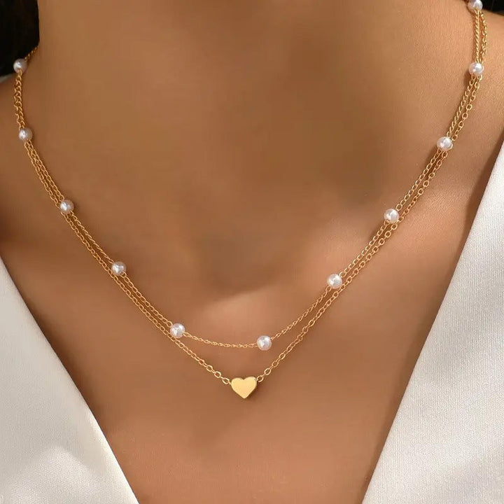 Elegant double layer white pearl necklace for women. Delicate fashion jewelry, perfect accessory.